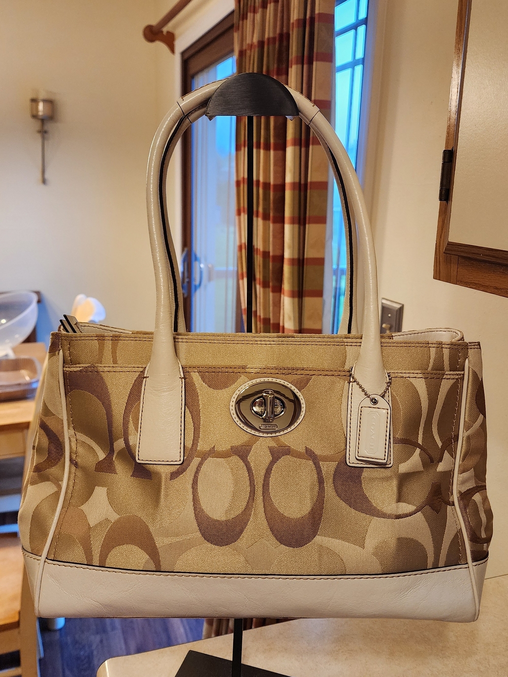 Coach Hamptons Madeline Signature tote bag featuring a brown canvas monogram